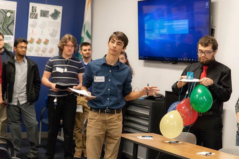 Male student speaks to group